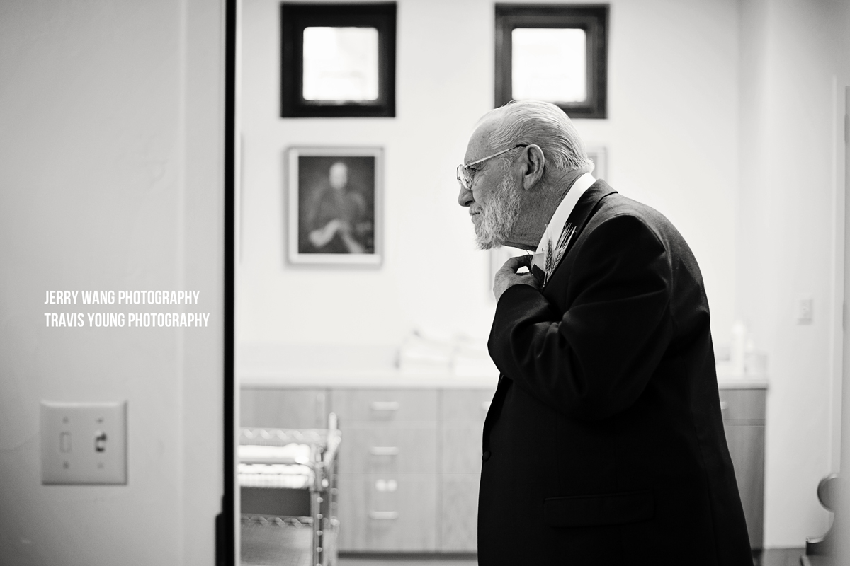 Father of the bride adjusting his tie